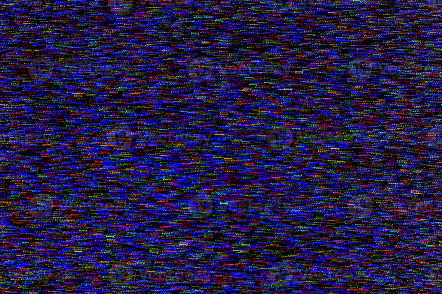 abstract random colored noise dots blurred by motion on black background photo