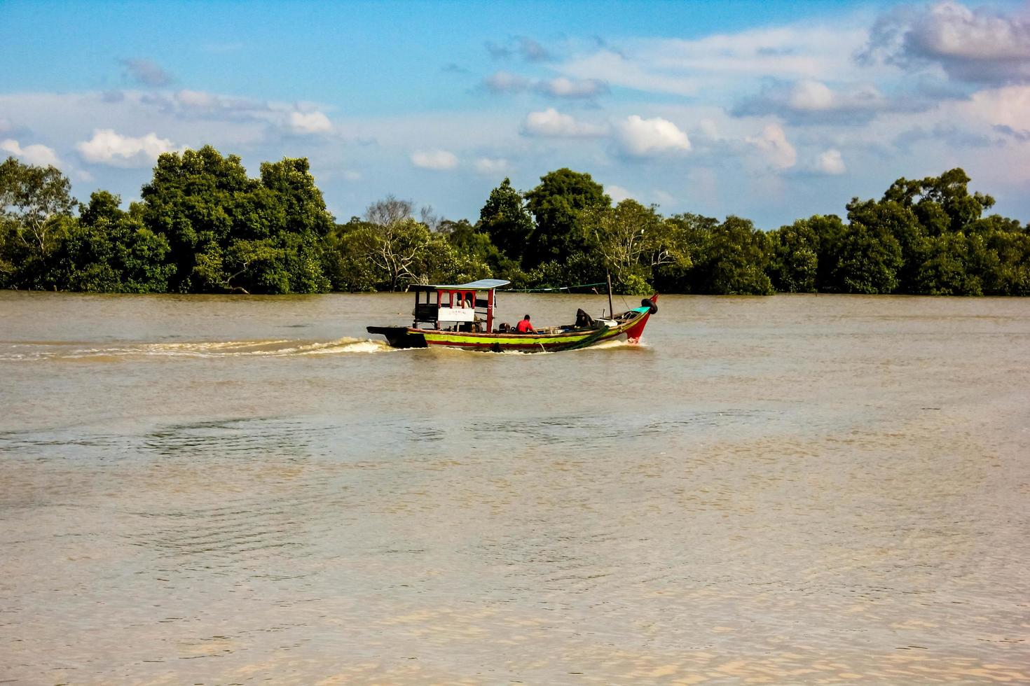 a fishing boat that sails on the river to the open sea to look for fish photo