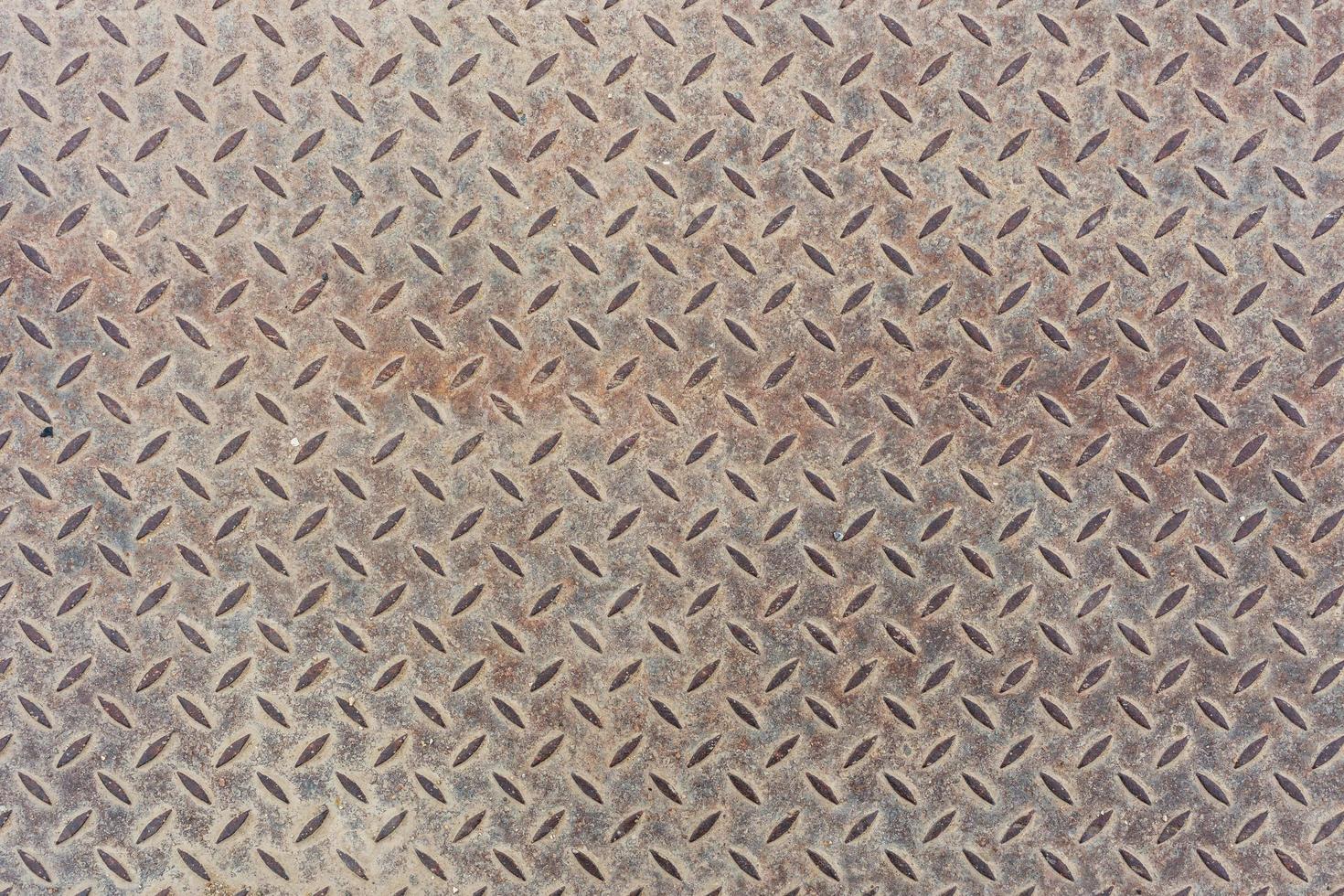 Gray dusty flat heavy metal sheet floor texture with diamond or checker or tread skid proof pattern. Background and texture. photo