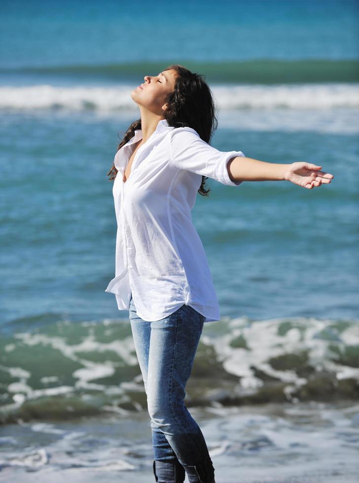 happy young woman on beach photo