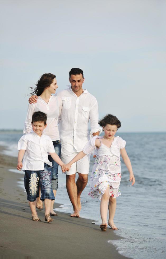 happy young family have fun on beach photo