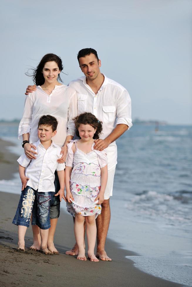 happy young family have fun on beach photo