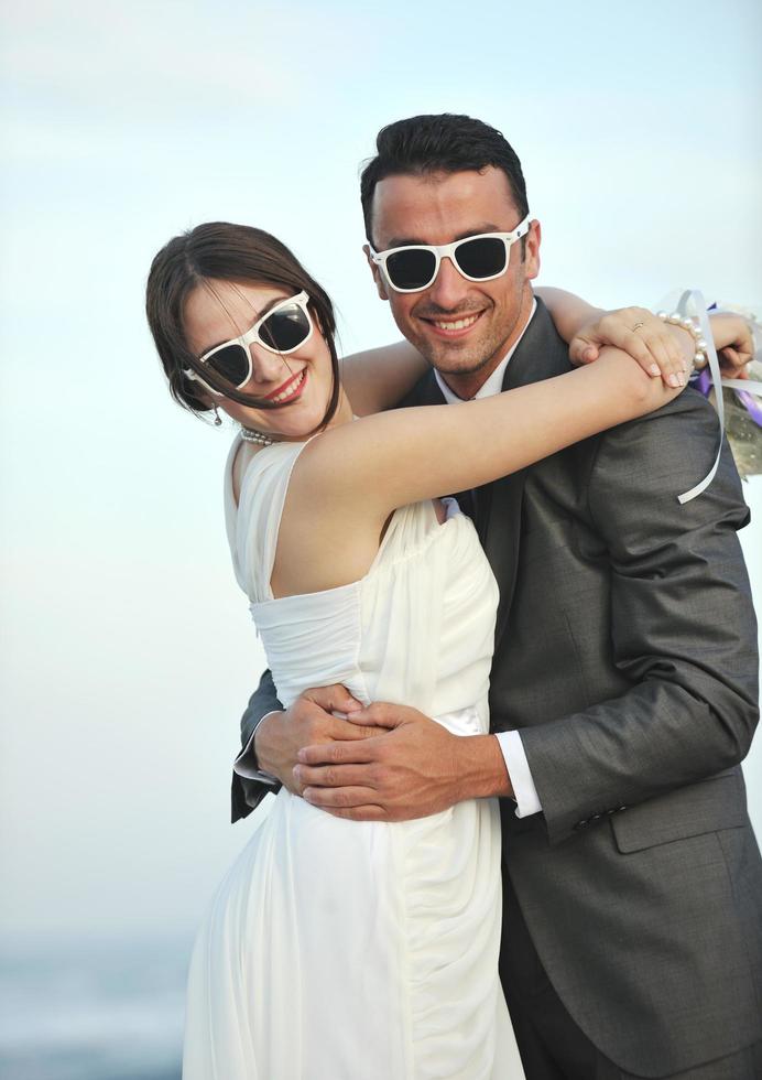 romantic beach wedding at sunset photo