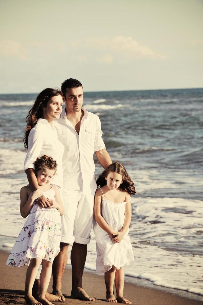 happy young  family have fun on beach photo