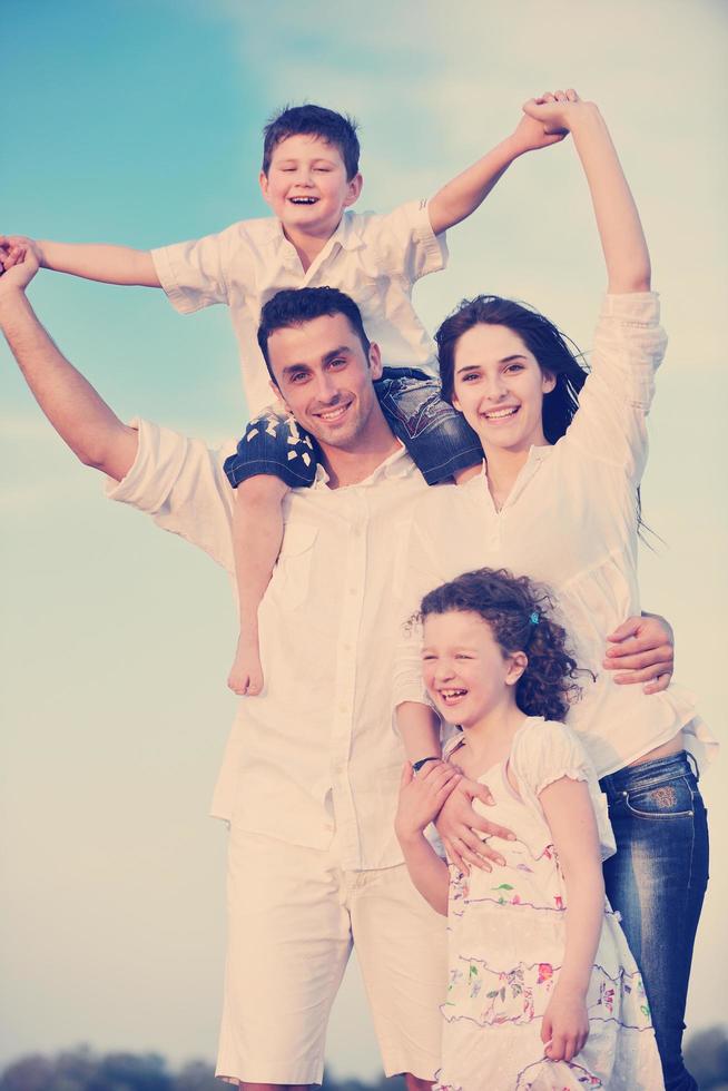 happy young family have fun on beach photo