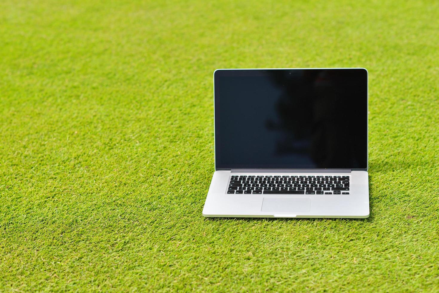 laptop computer  on grass photo