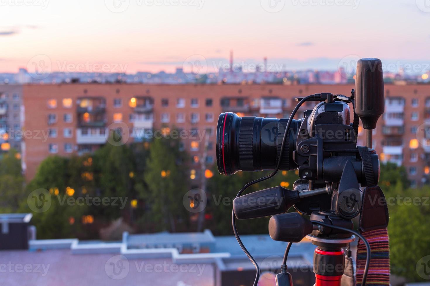 pro dslr on tripod in evening roof photoshoot photo