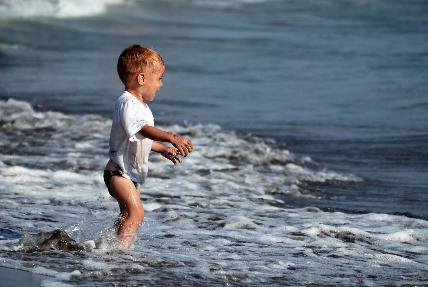 little boy at the beach photo
