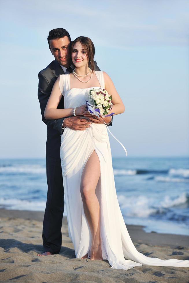 romantic beach wedding at sunset photo
