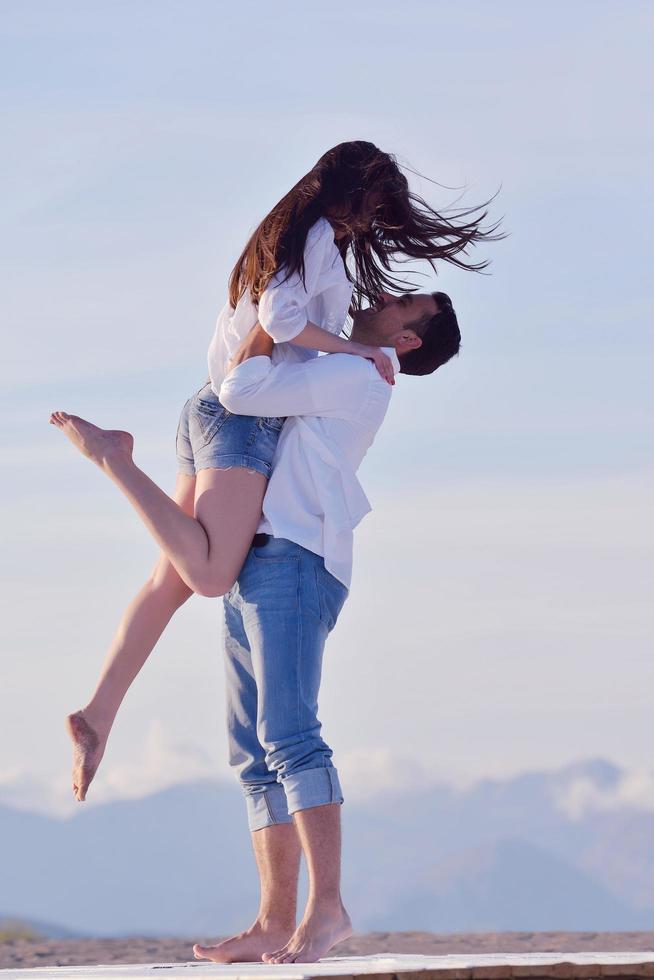 young couple  on beach have fun photo