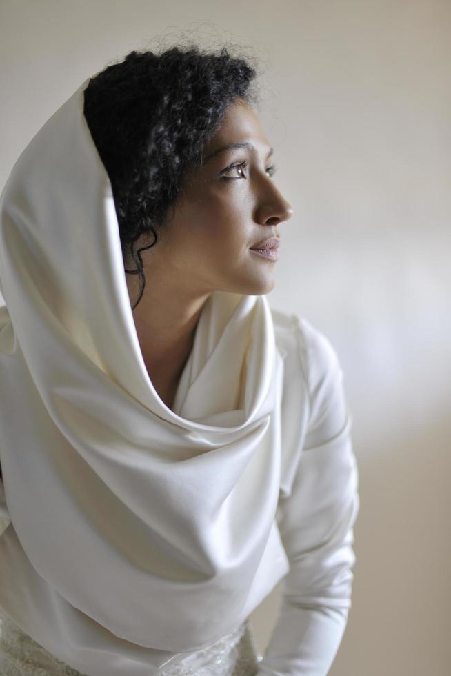 Portrait of a beautiful woman dressed as a bride photo