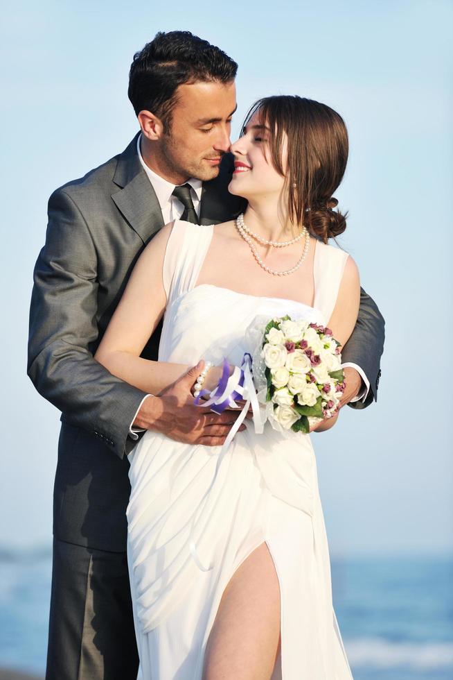 romantic beach wedding at sunset photo