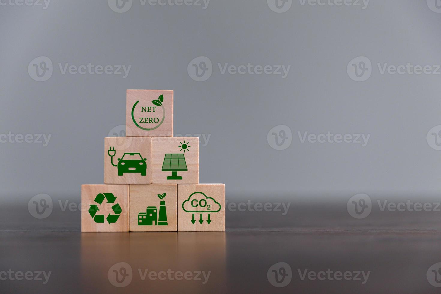 Companies are targeting net zero greenhouse gas emissions. Carbon credit concept.Tradable certificate to drive industry in direction of low emissions in efficiency cost. Wooden cubes with decrease CO2 photo