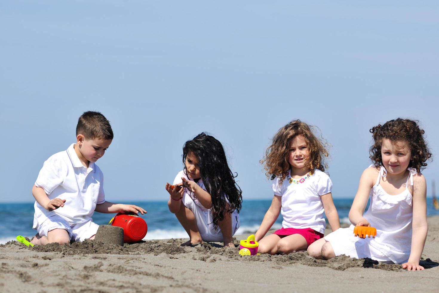 kids playing on beach photo