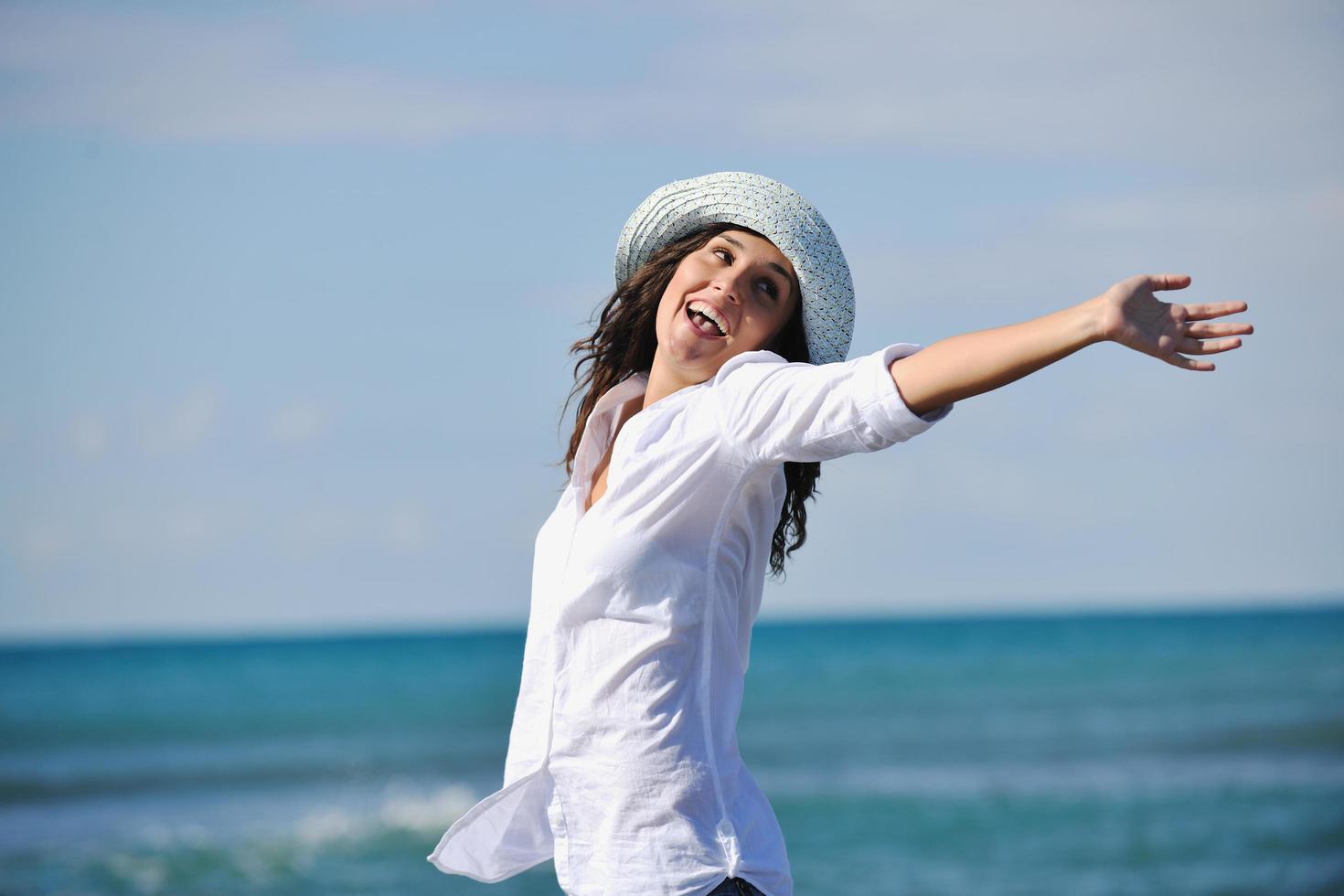 happy young woman on beach photo