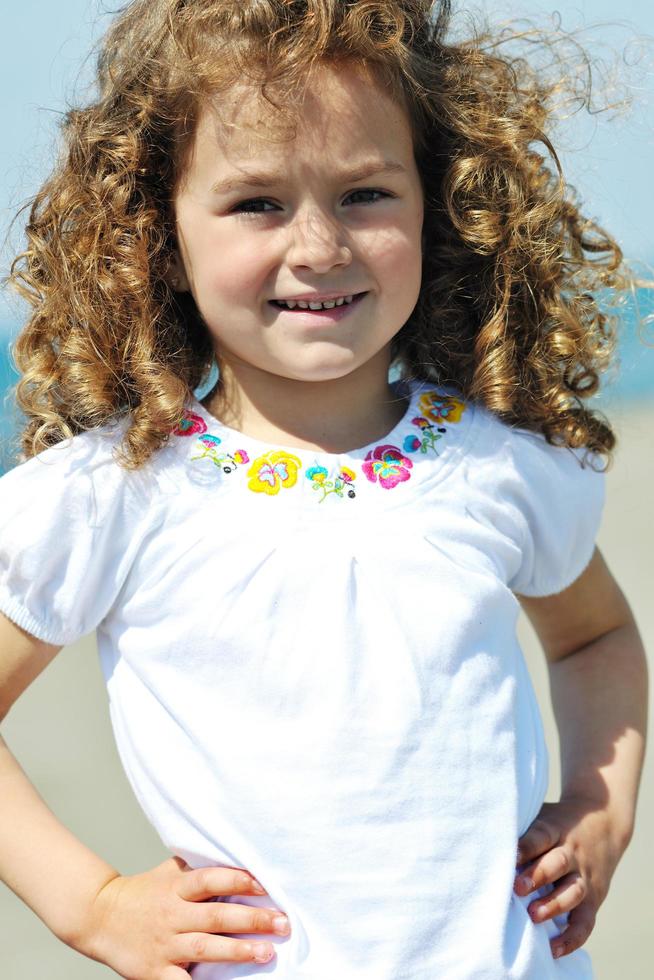 little female  child portrait on the beach photo