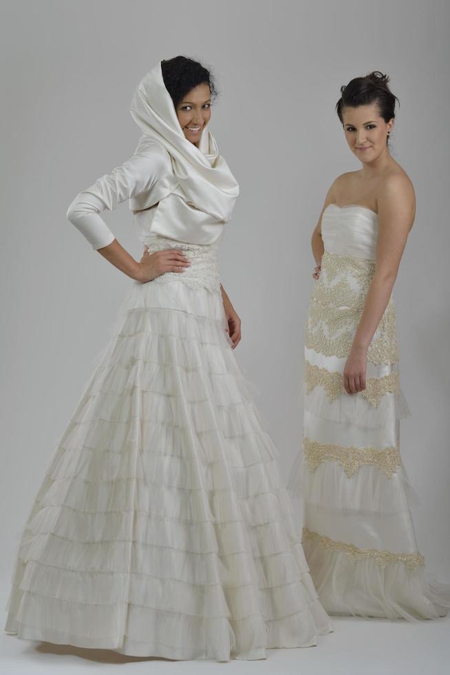 portrait of a three beautiful woman in wedding dress photo