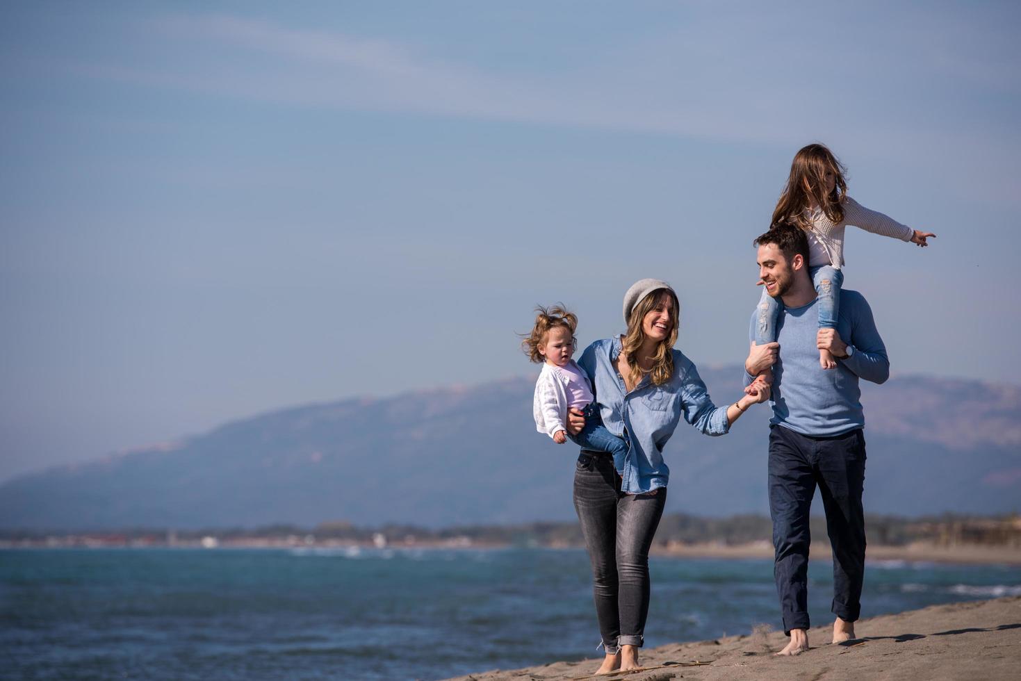 Young family enjoying vecation during autumn photo