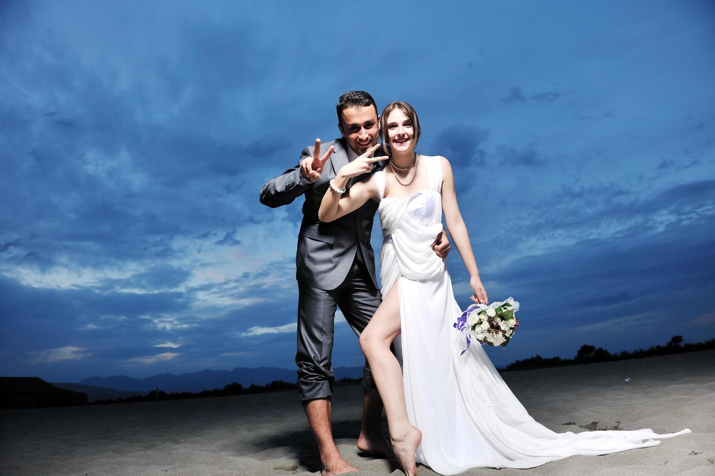 romantic beach wedding at sunset photo