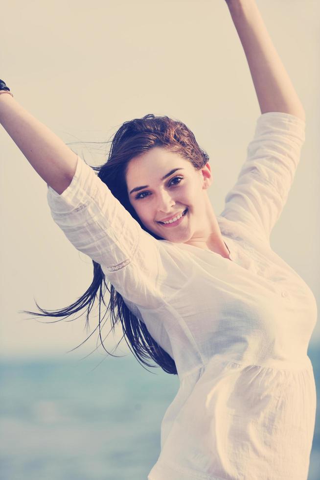 young woman enjoy on beach photo