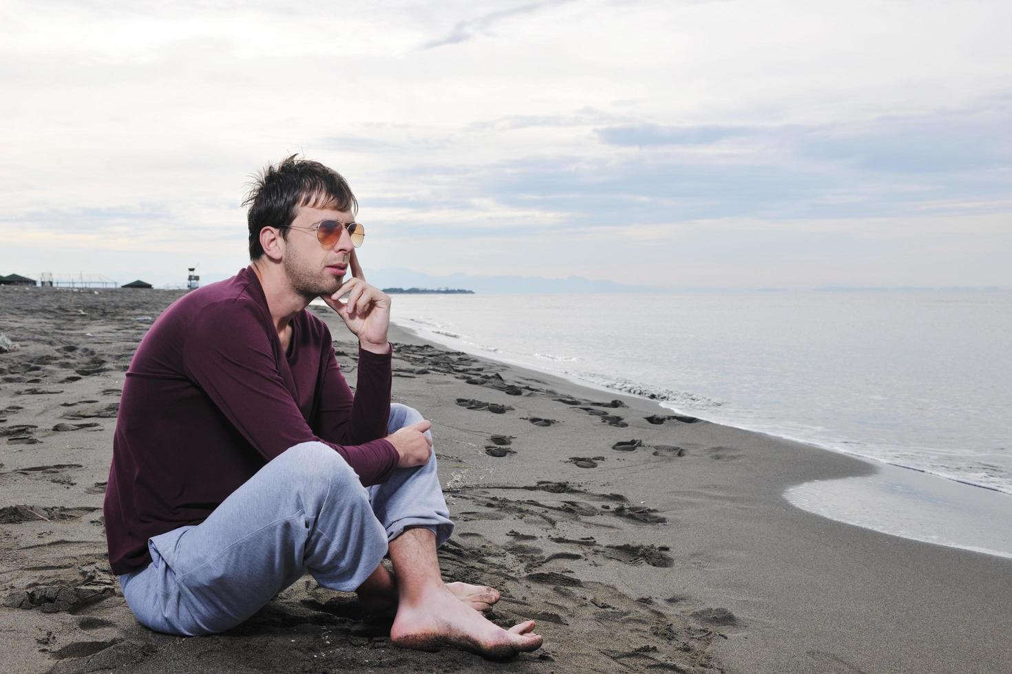 young man at beach photo