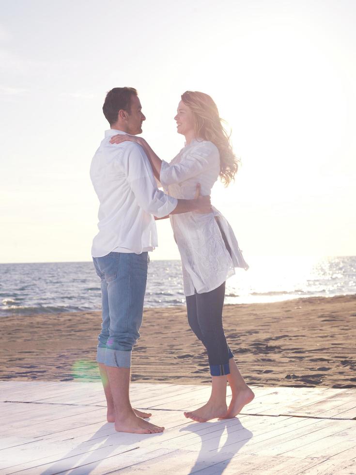 young couple  on beach have fun photo