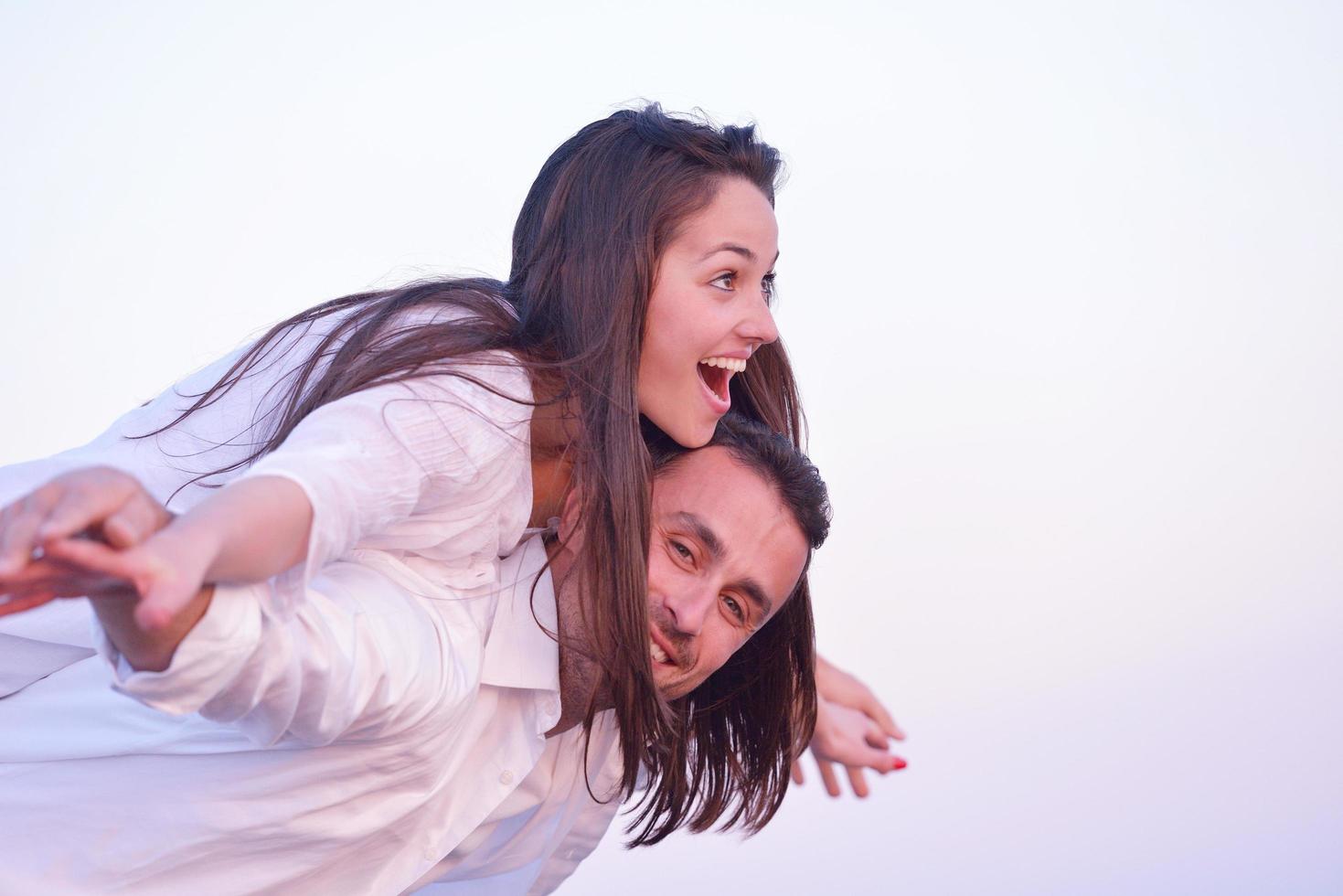 young couple  on beach have fun photo