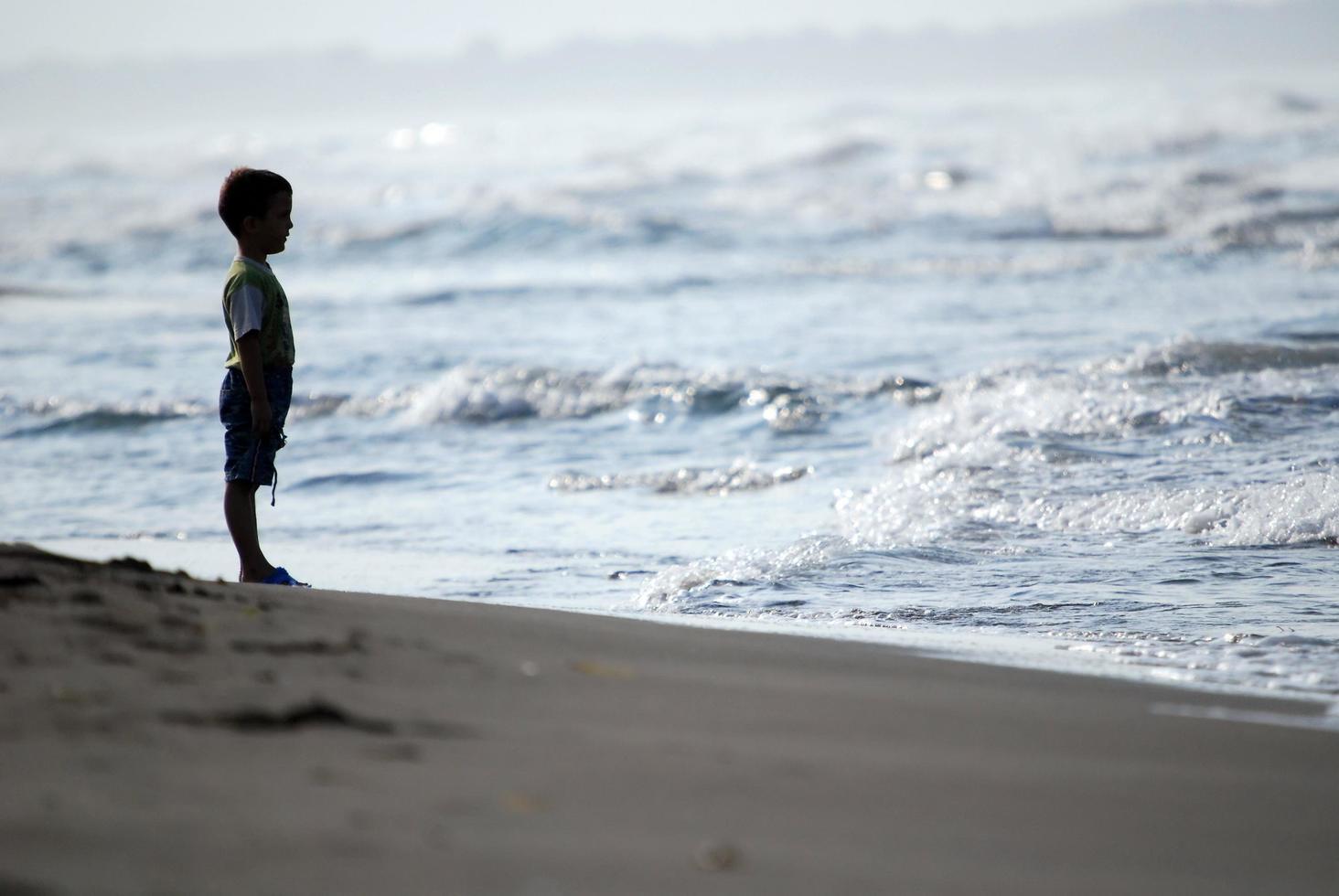 Kid on beach photo