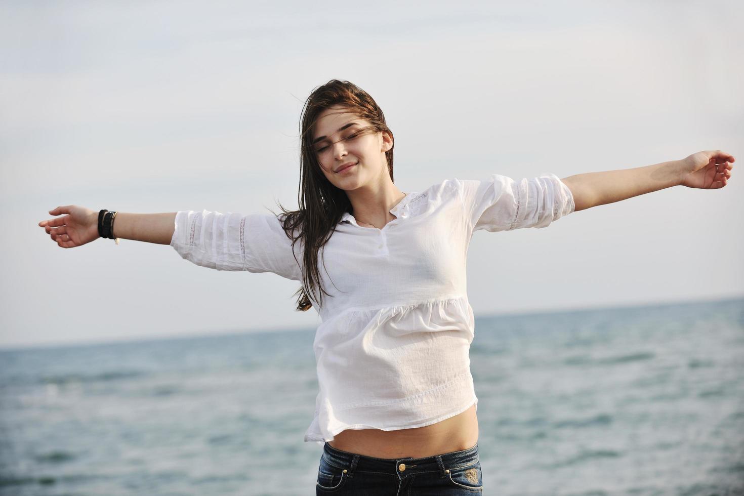 young woman enjoy on beach photo