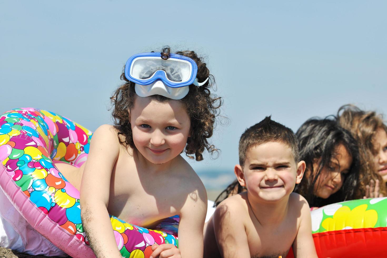 child group have fun and play with beach toys photo