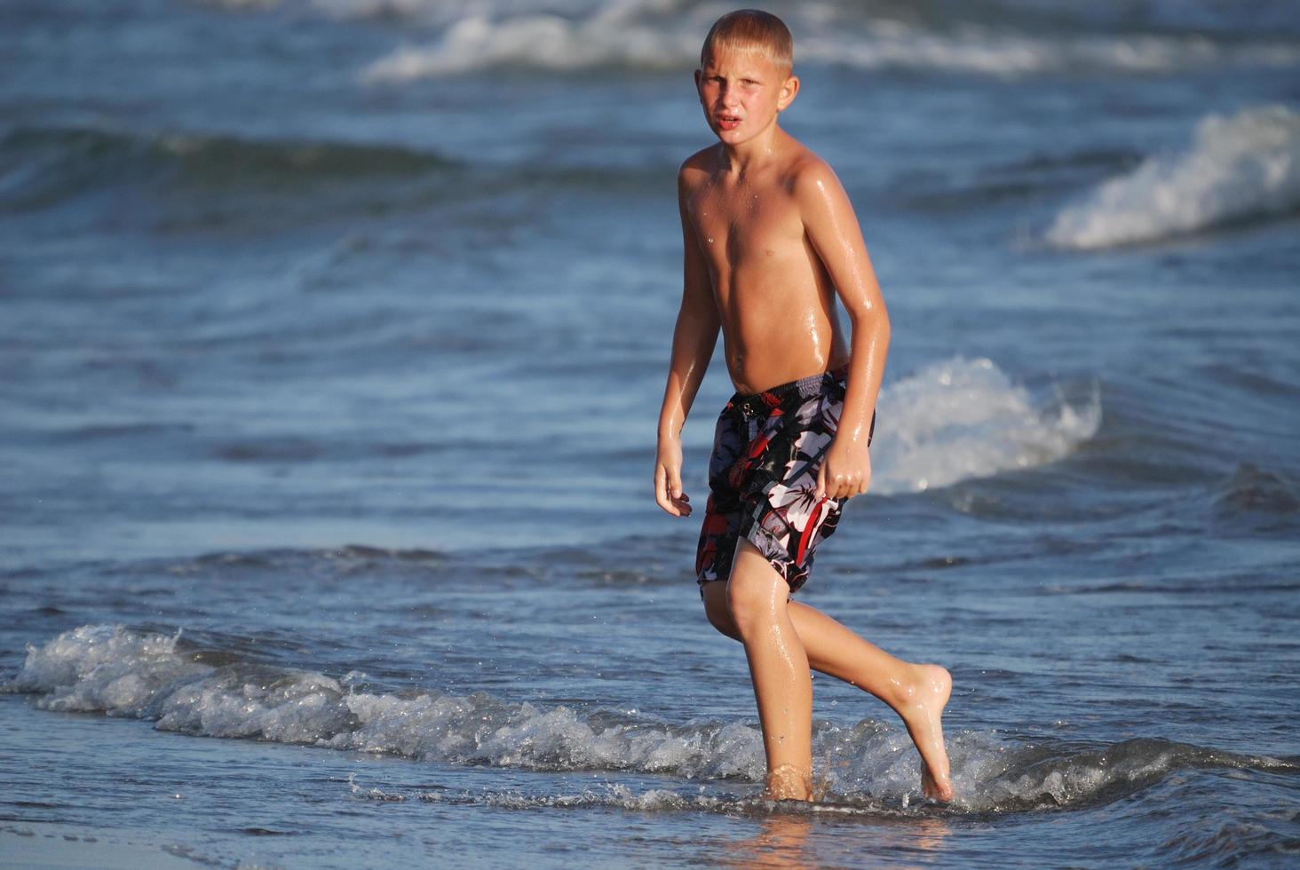 Kid on beach photo