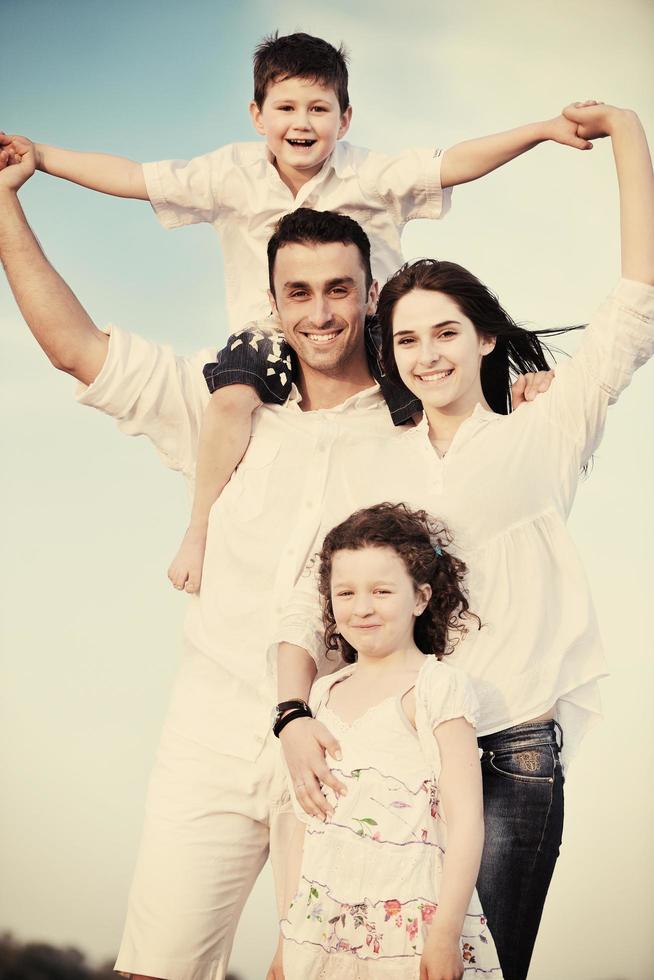 happy young family have fun on beach photo