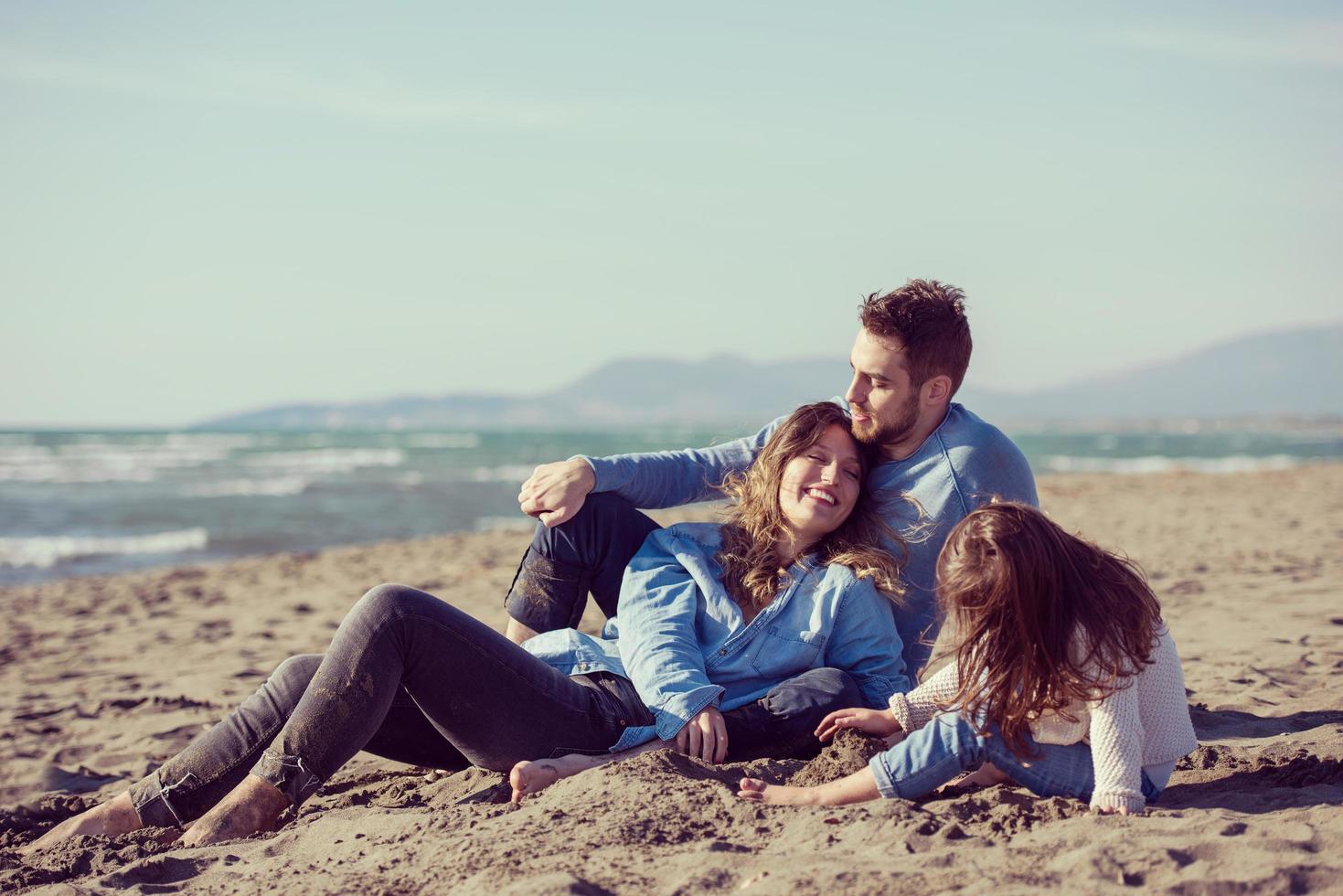 Young family enjoying vecation during autumn photo