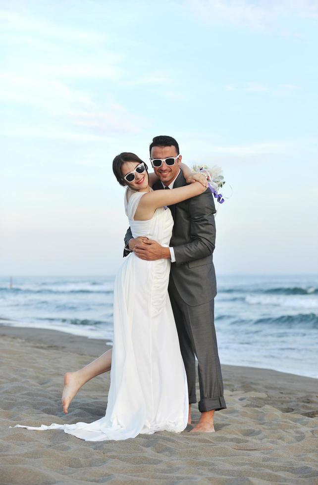 romantic beach wedding at sunset photo