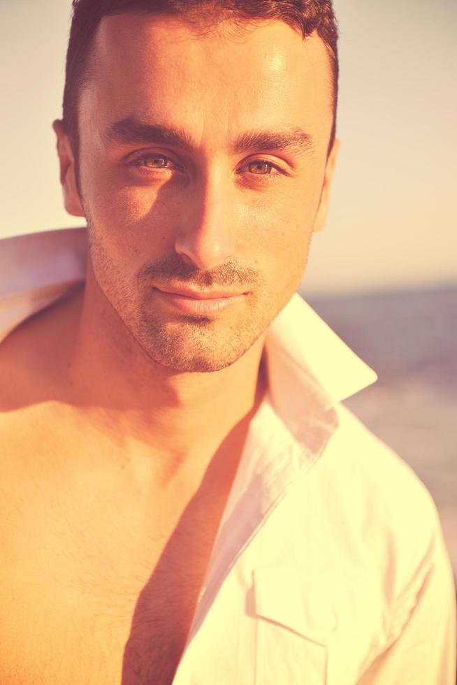 young man at beach photo