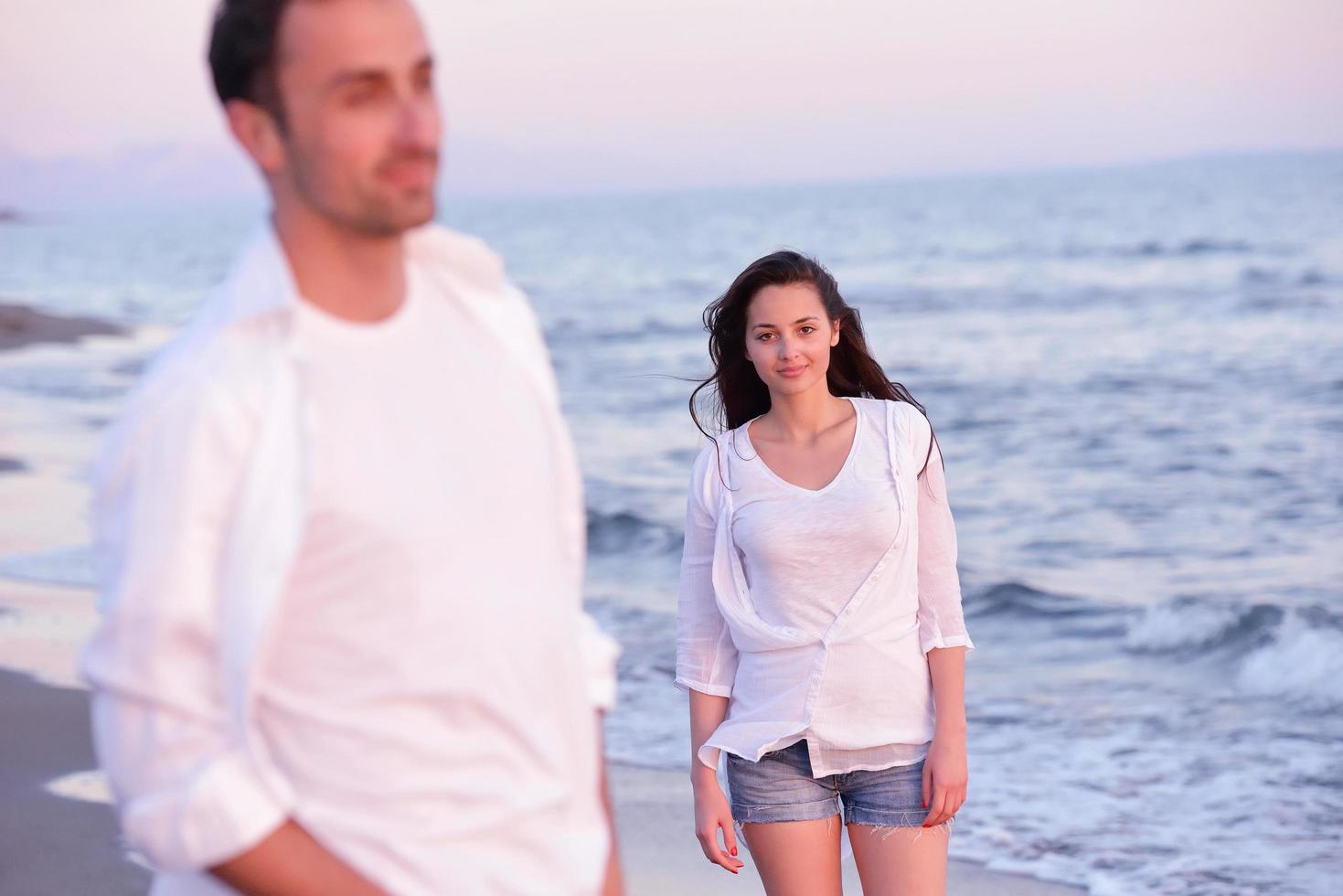 young couple  on beach have fun photo