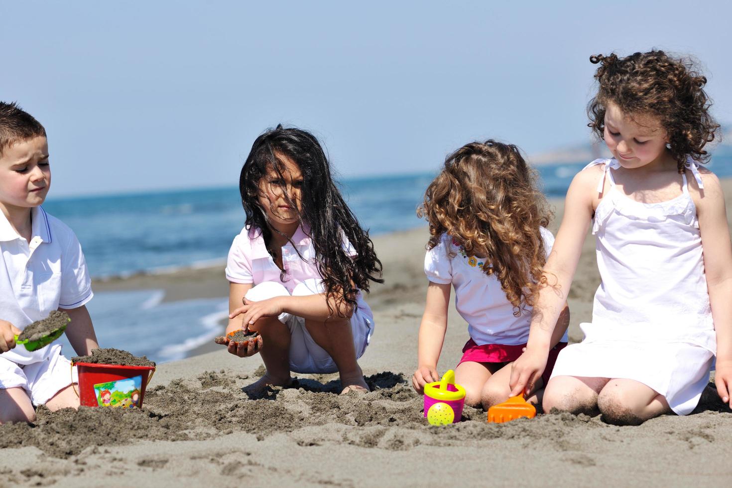 kids playing on beach photo