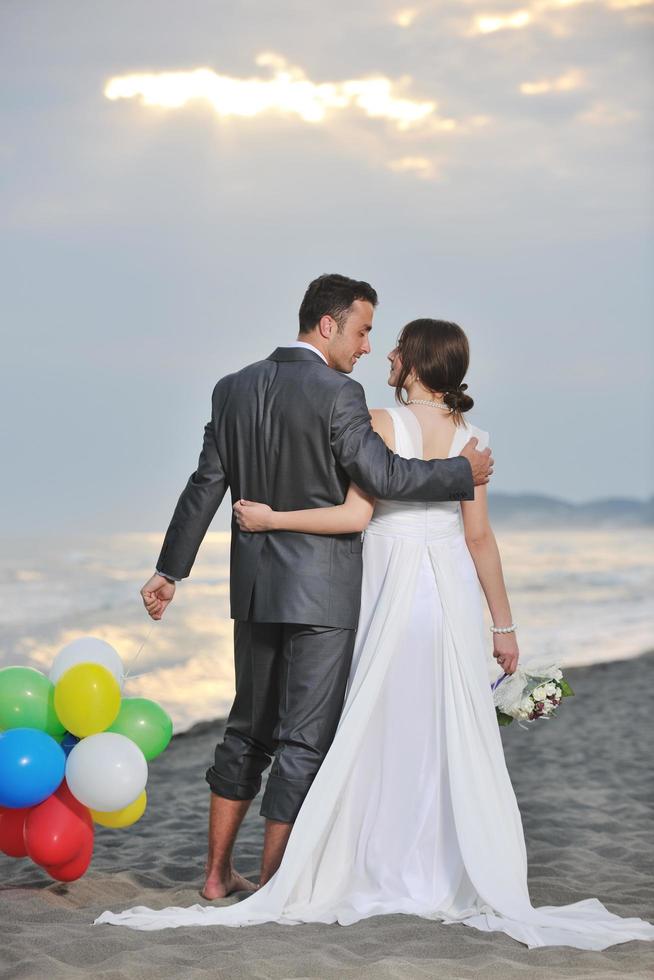 romantic beach wedding at sunset photo