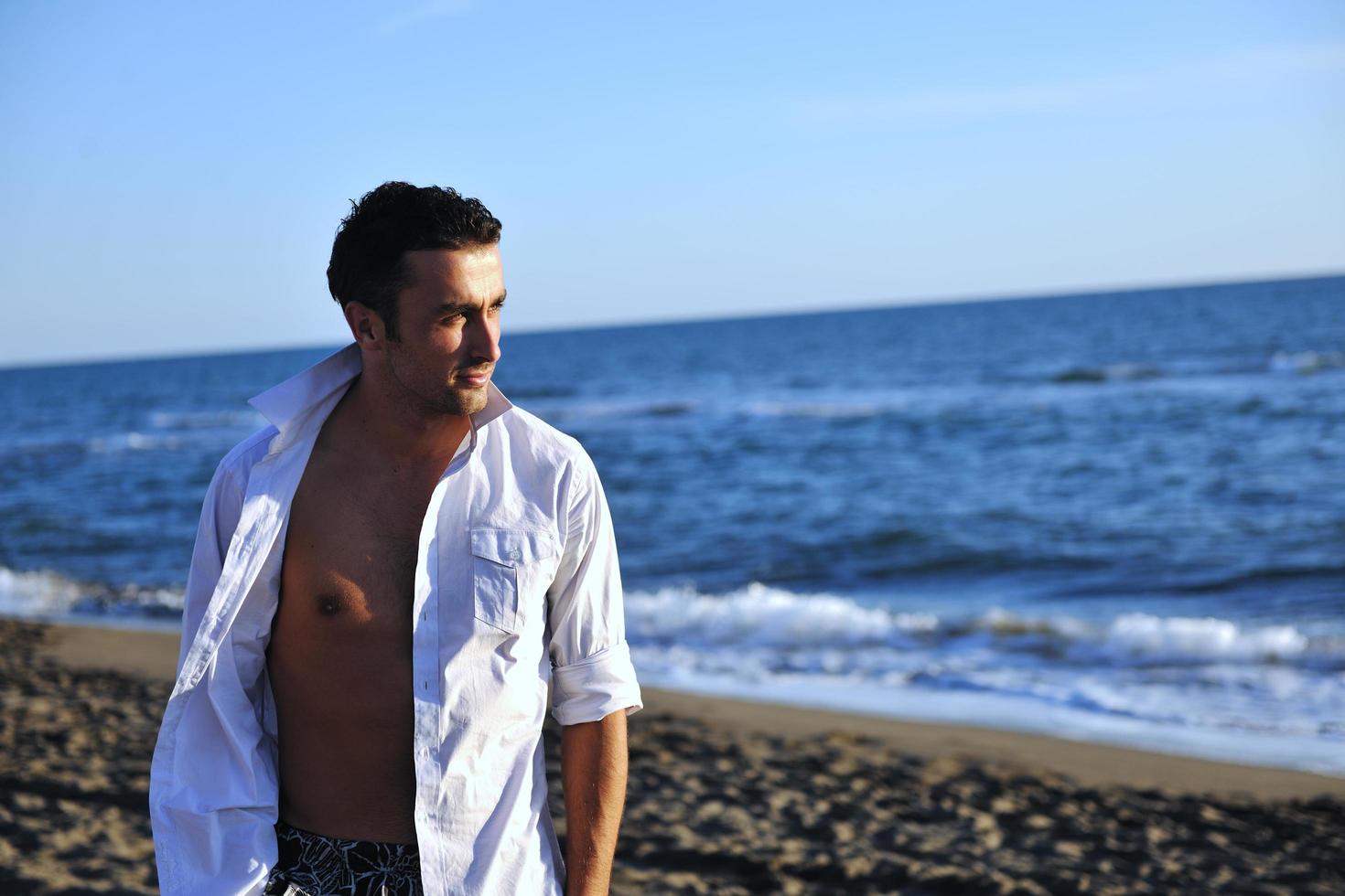 young man at beach photo