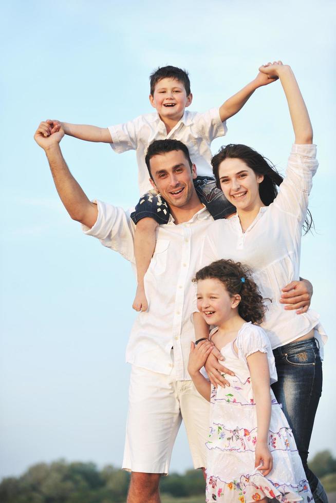 happy young family have fun on beach photo