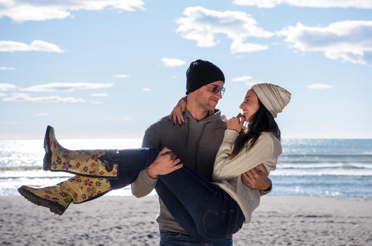 Couple chating and having fun at beach bar photo