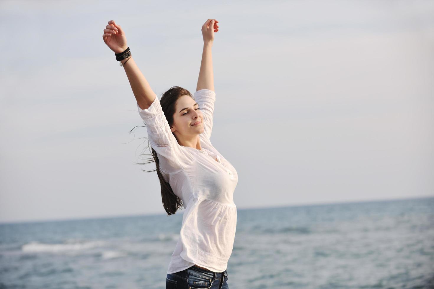 young woman enjoy on beach photo