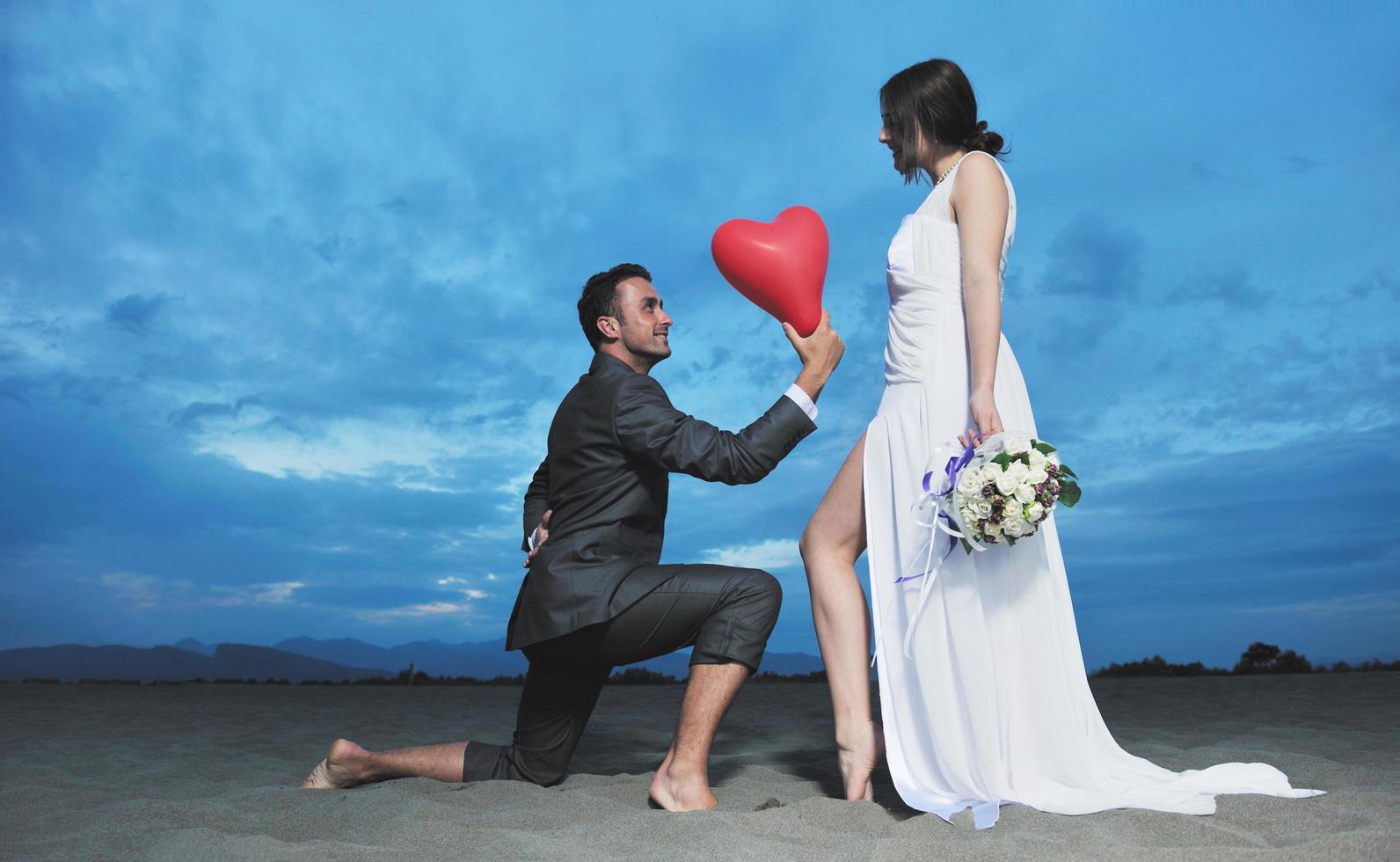 romantic beach wedding at sunset photo