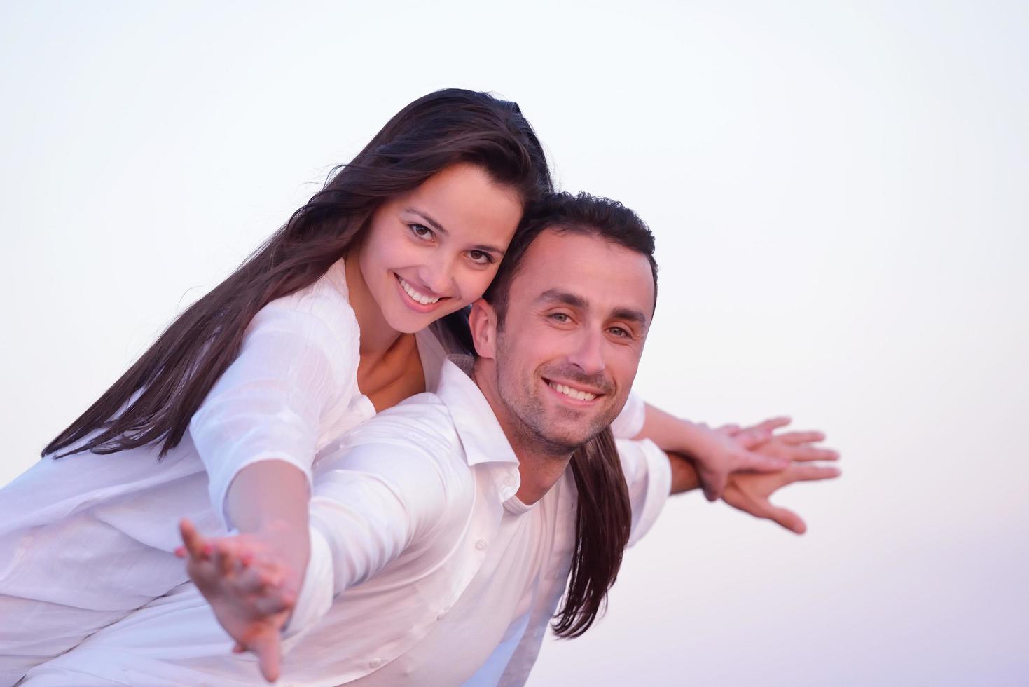 young couple  on beach have fun photo