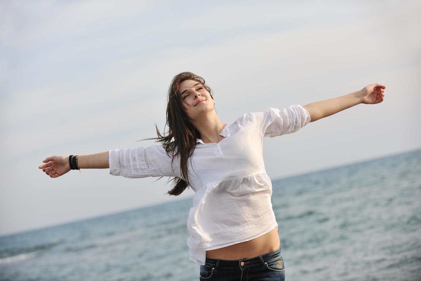 young woman enjoy on beach photo