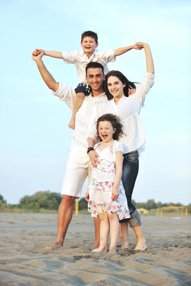 happy young family have fun on beach photo