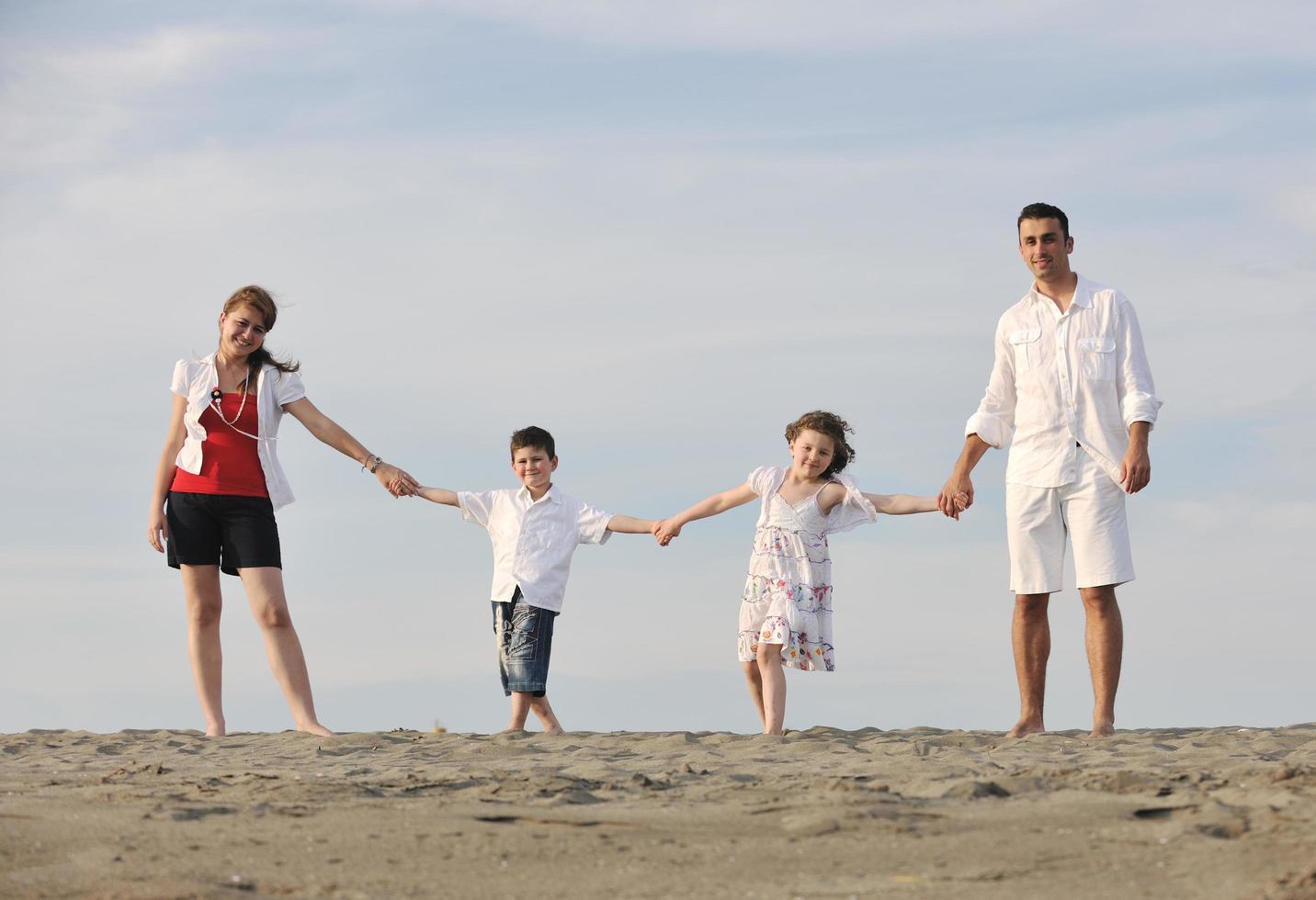 happy young family have fun on beach photo