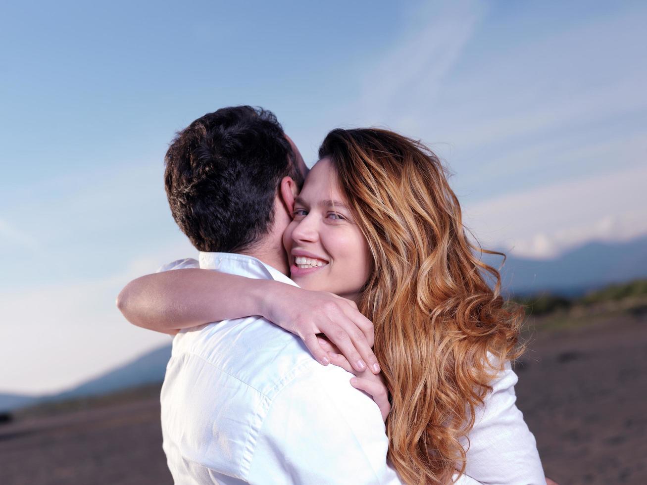 young couple  on beach have fun photo