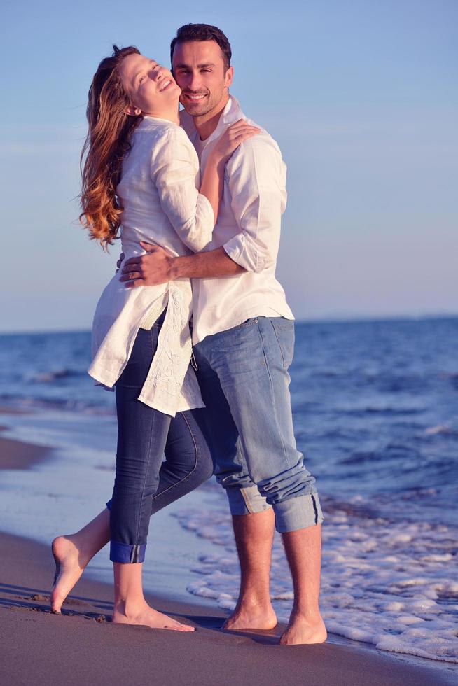 young couple  on beach have fun photo
