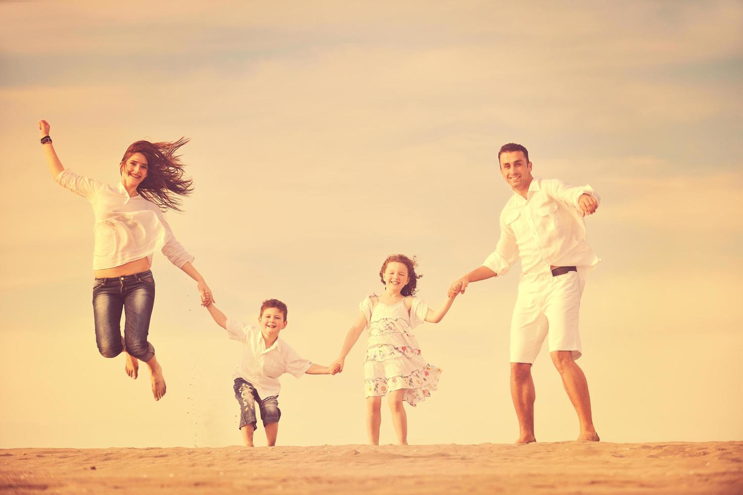 happy young family have fun on beach photo